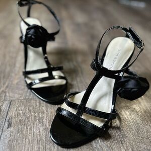 Ann Marino Black leather ankle strap heels with rose detail
Size 8